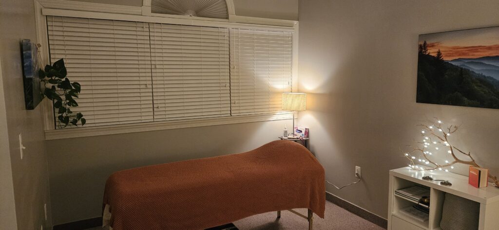 Decorative picture of the office and Reiki table in soft lighting